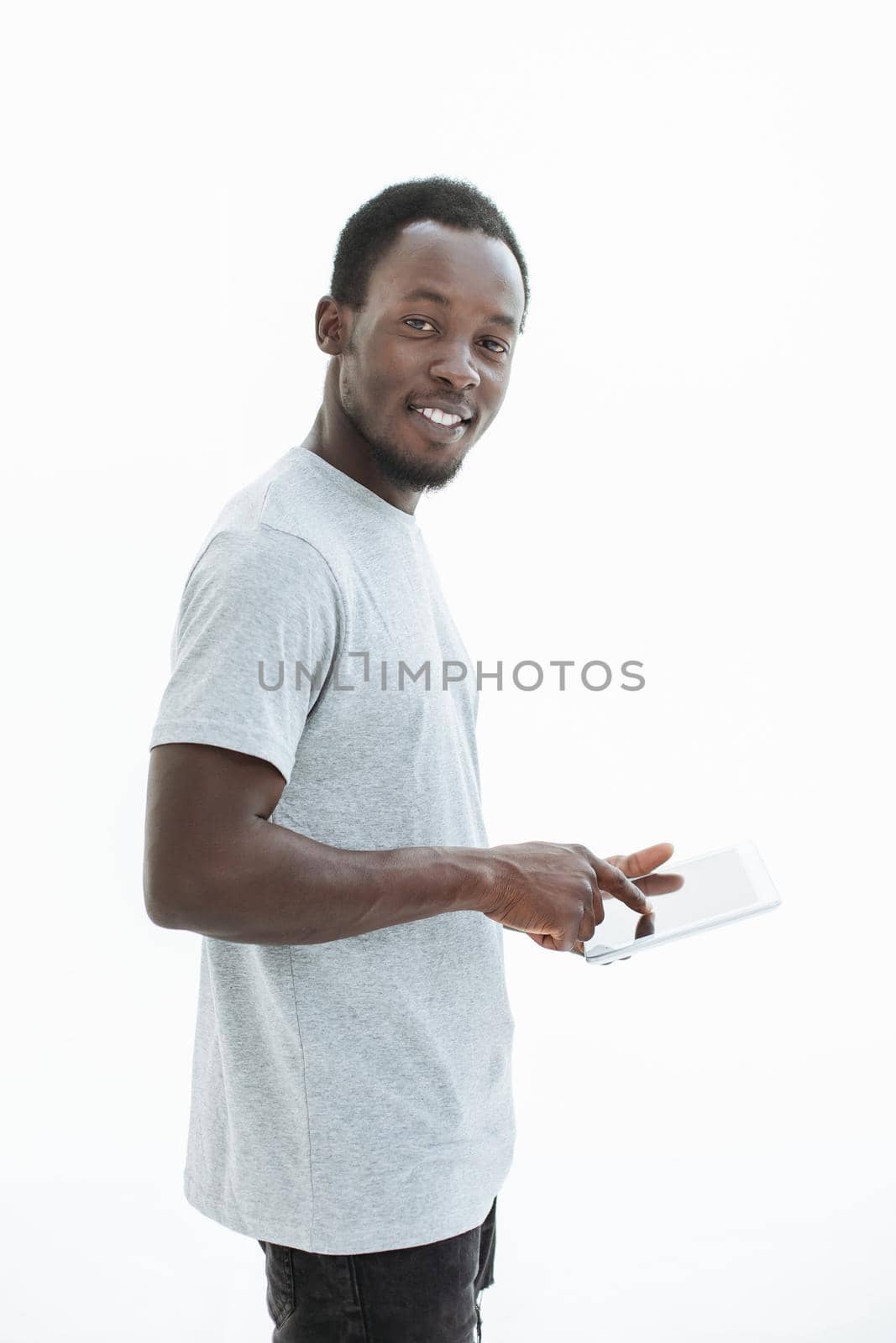 handsome modern guy with a digital tablet. isolated on white background