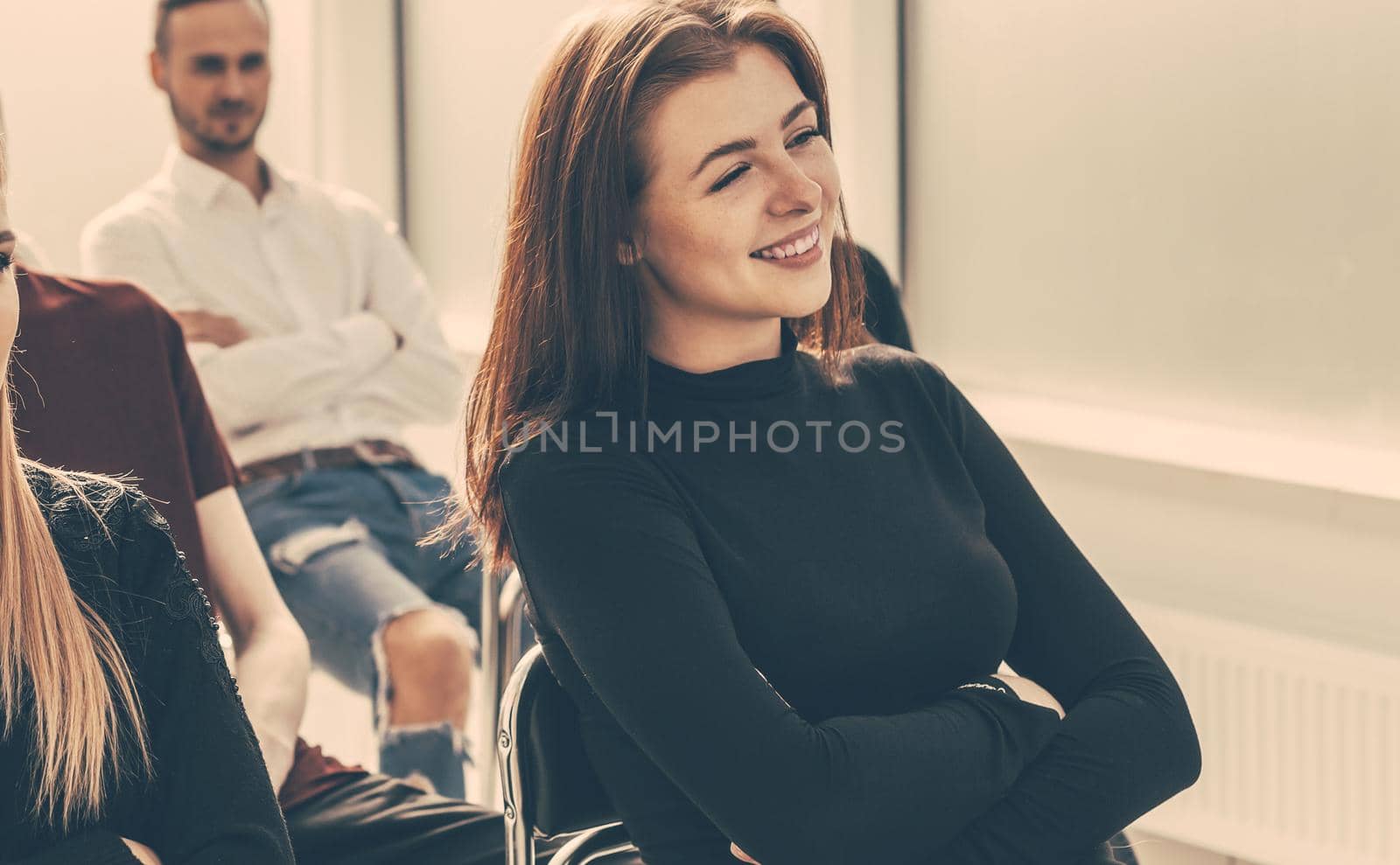 working group of young professionals sitting in the conference room by SmartPhotoLab