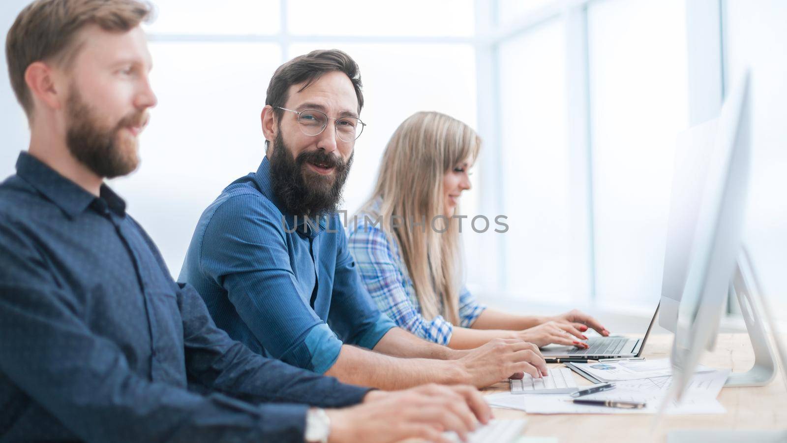 group of business people working in the office together by SmartPhotoLab