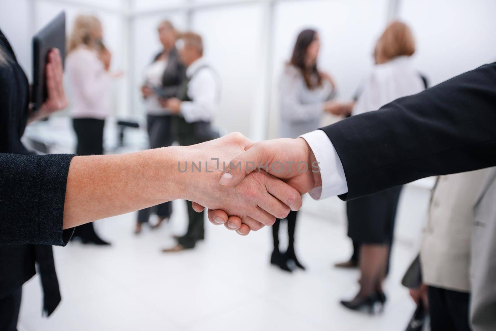close up. businessman and businesswoman shaking hands . business concept
