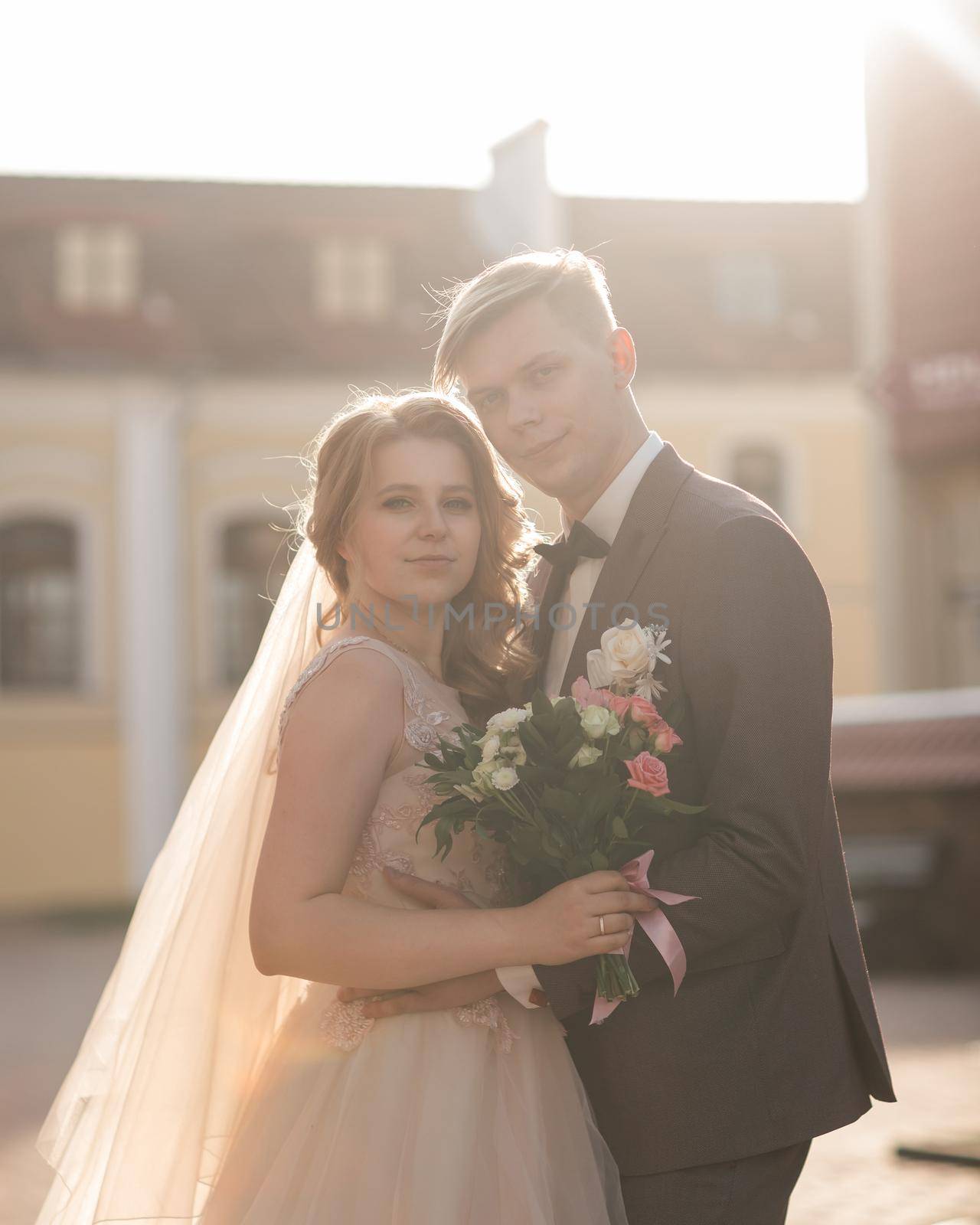 bride and groom look at each other tenderly. holidays and events