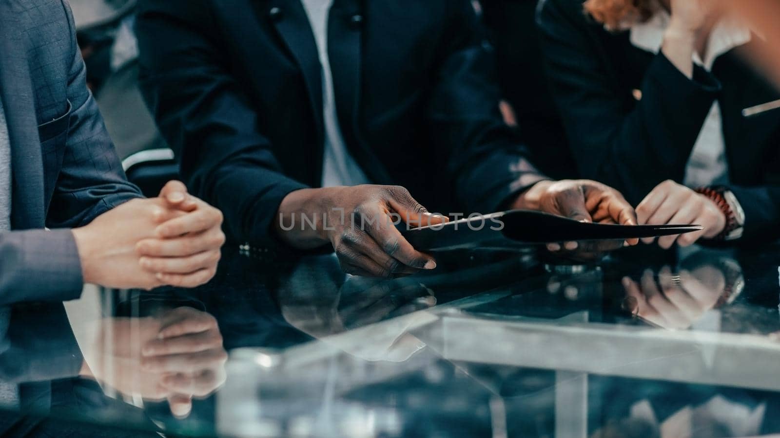 close up. working group at a meeting at the office Desk . the concept of teamwork