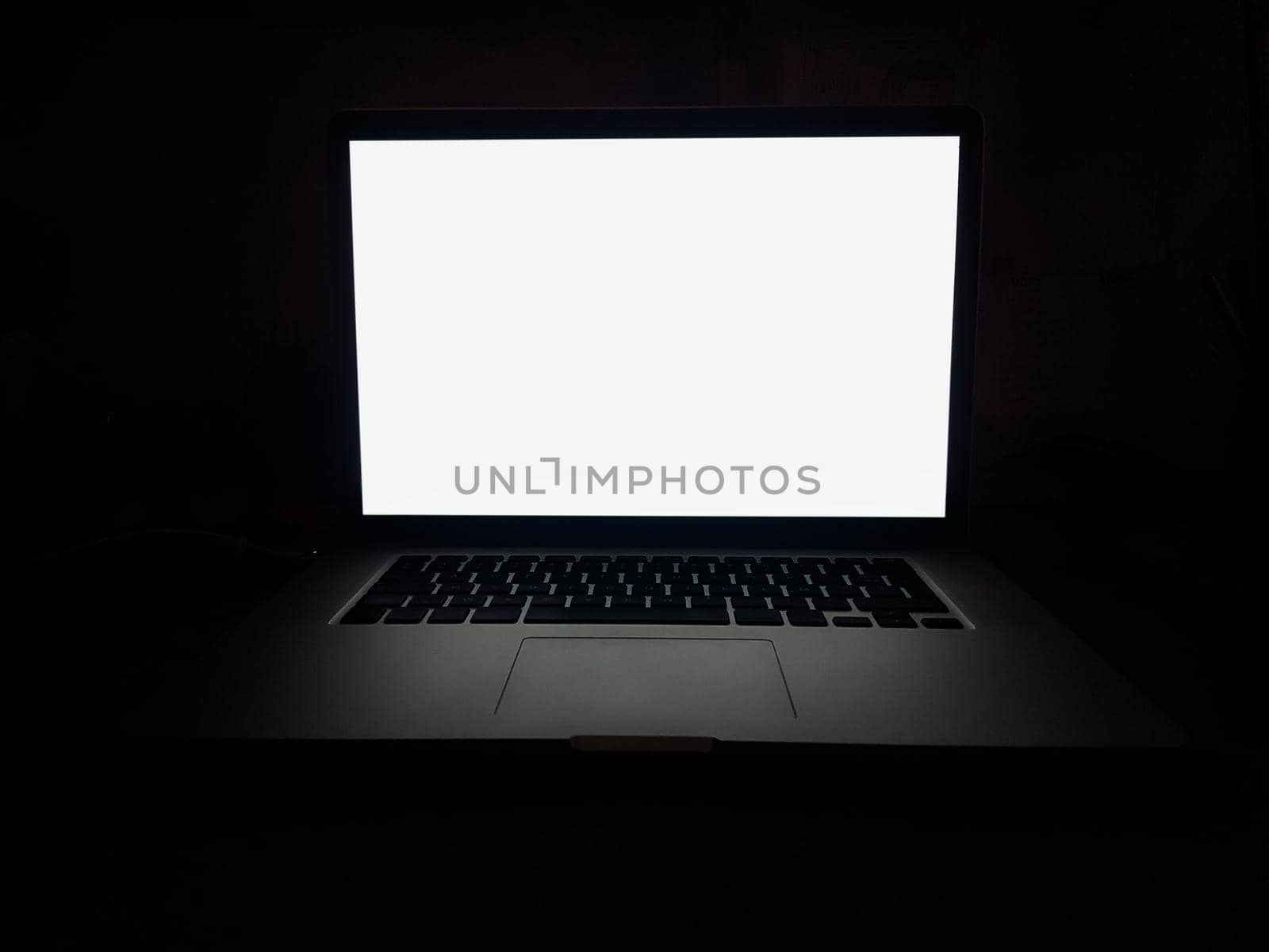 close up. open laptop with blank screen on dark background