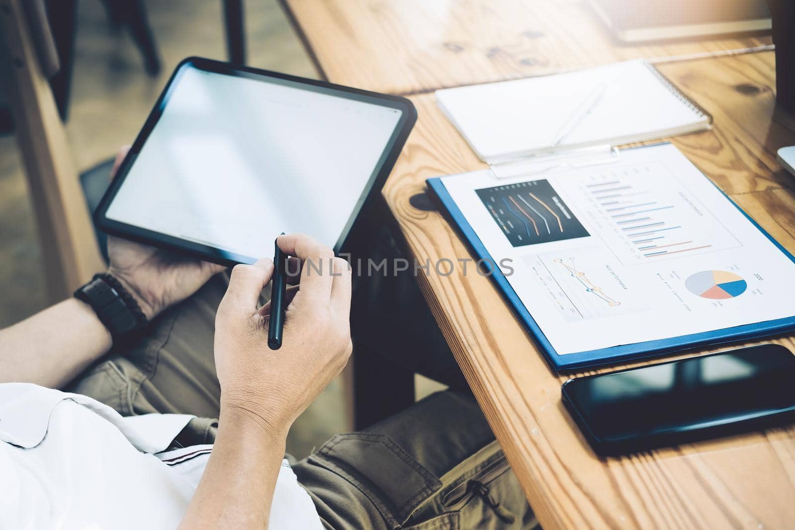 Financial Freedom, a stock analyst holding a pen pointing at a tablet Analyze the stock market to make a profit for your own portfolio. by Manastrong