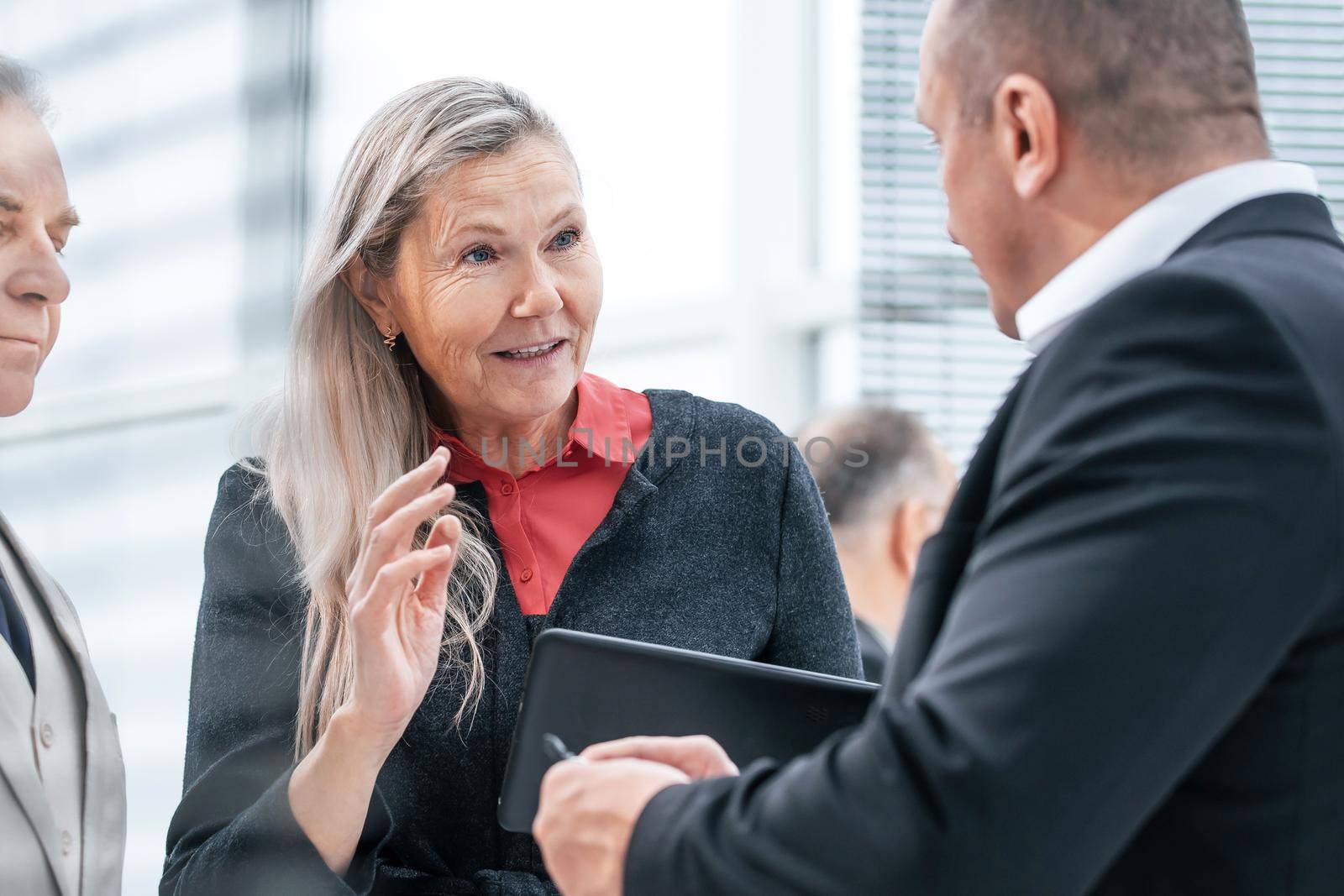 close up. a group of business people discussing business issues in a modern office