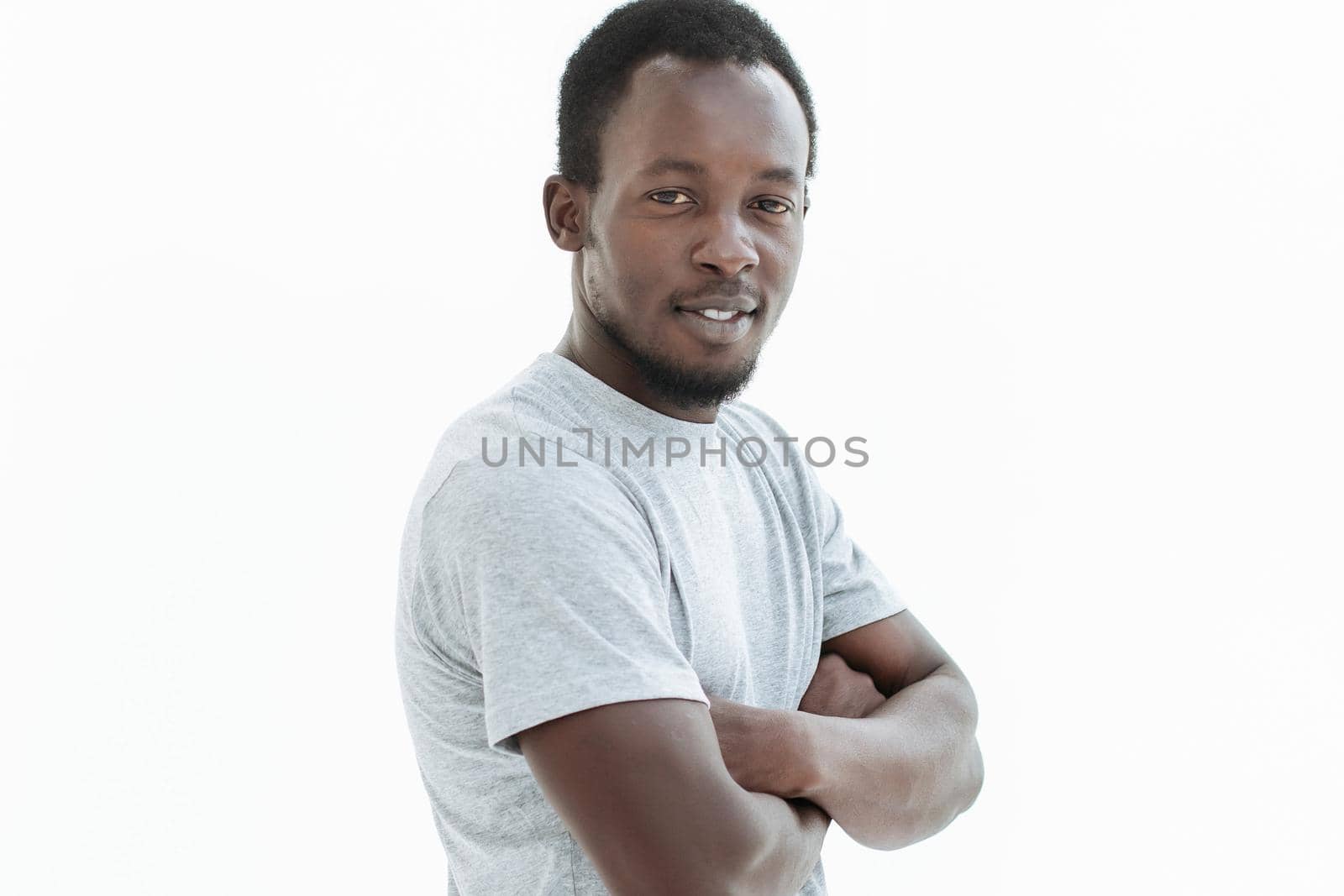 side view. confident guy looking at the camera. isolated on white background