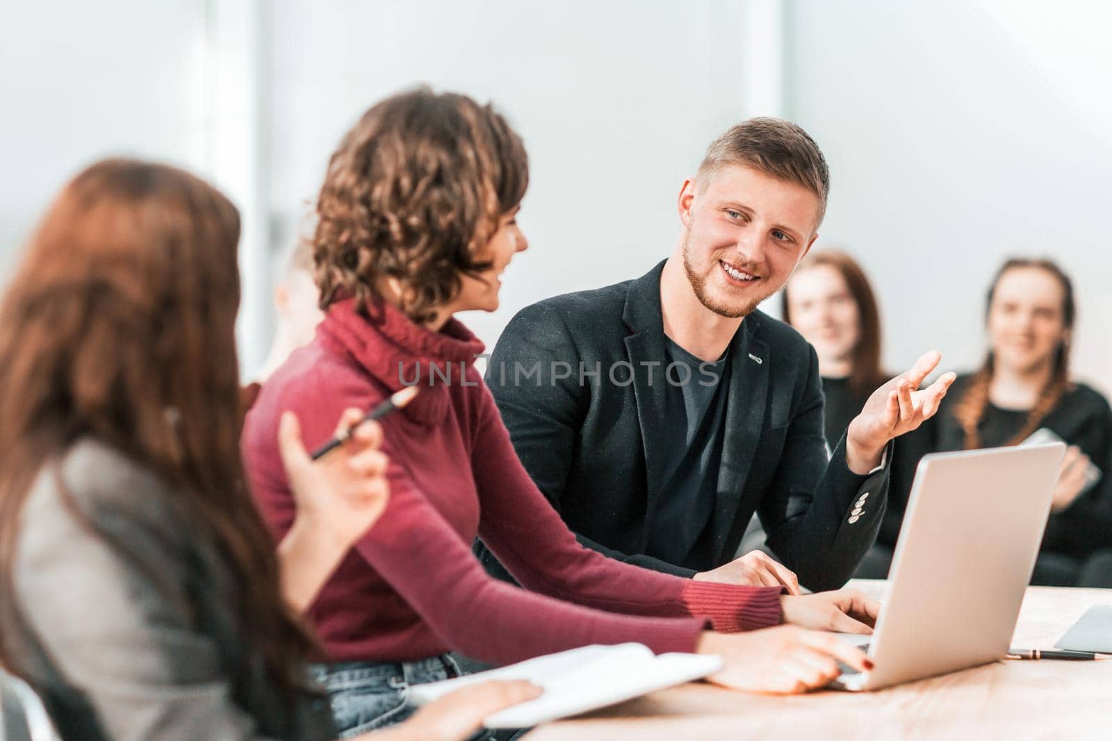 group of young employees sitting at the office Desk . business concept