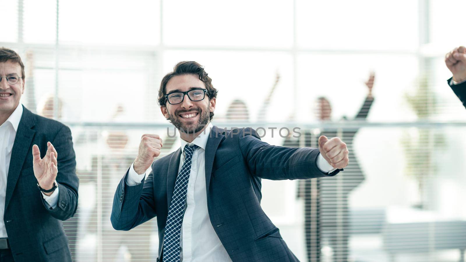 close up. group of successful employees is celebrating in the office.