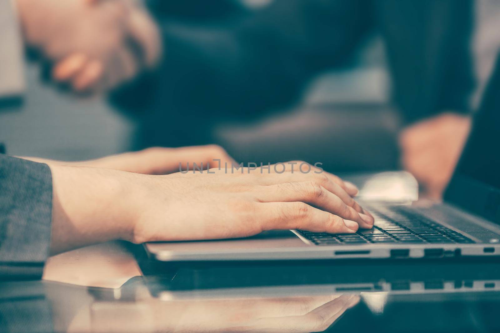 close up. modern man typing on a laptop keyboard. people and technology