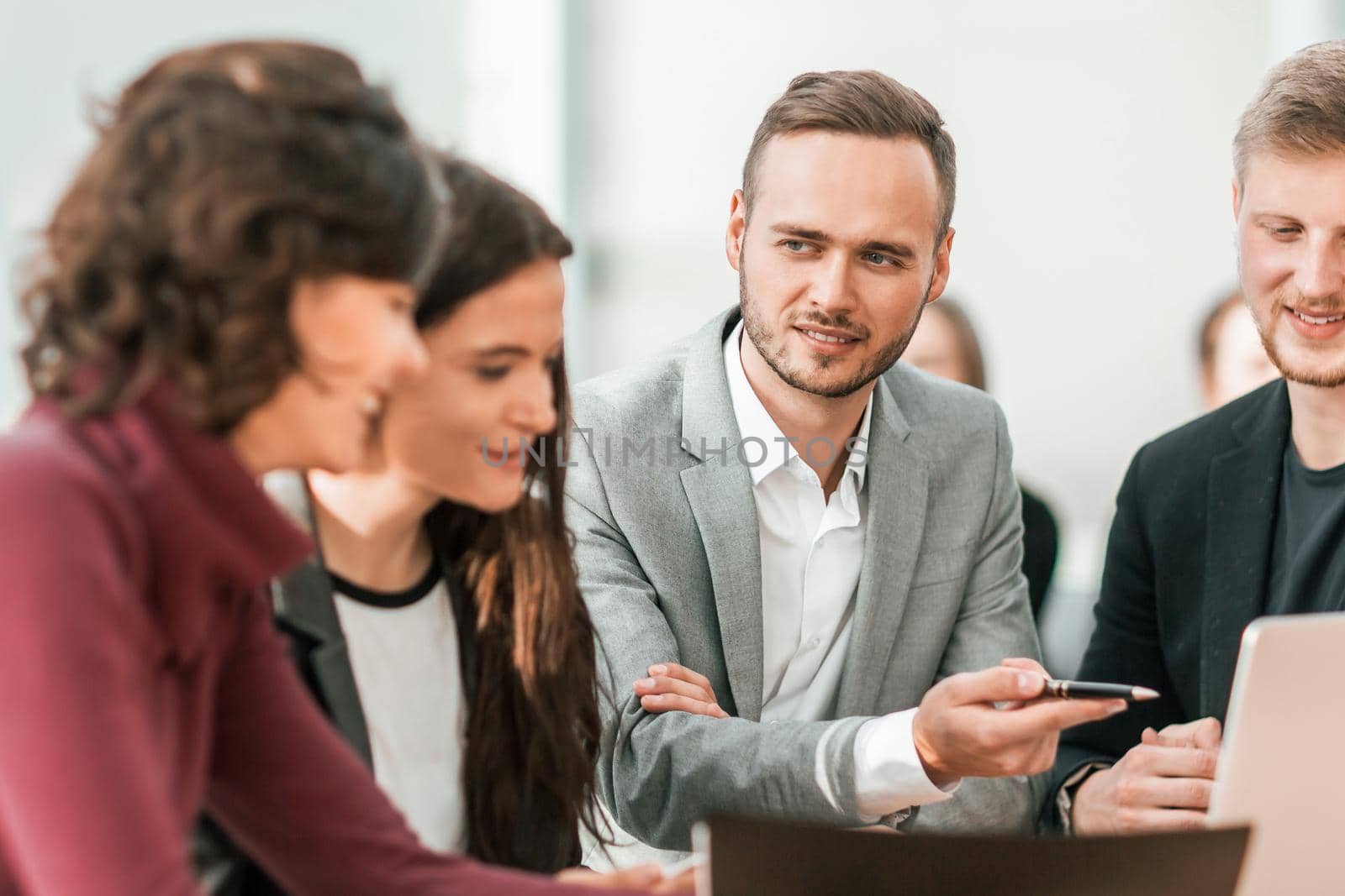 close up. young employees discussing problems at a group meeting.