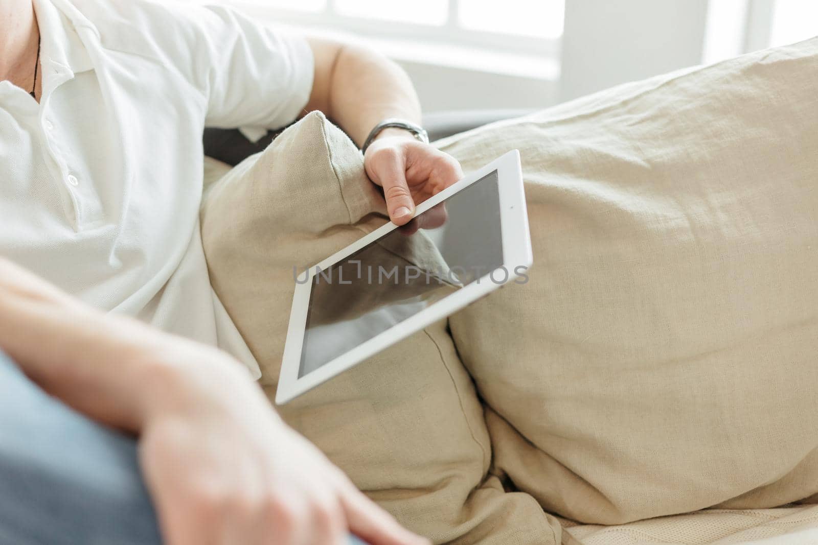 close up. young man reading mail on a digital tablet