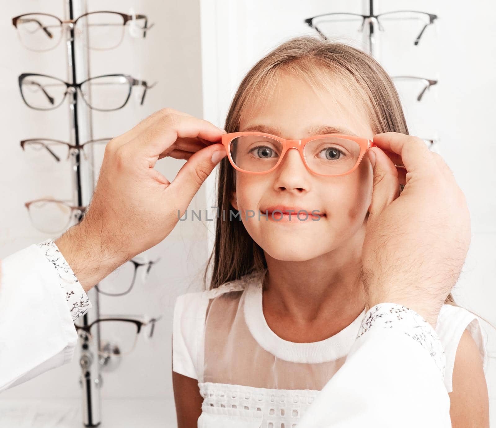 Little girl choosing glasses by GekaSkr