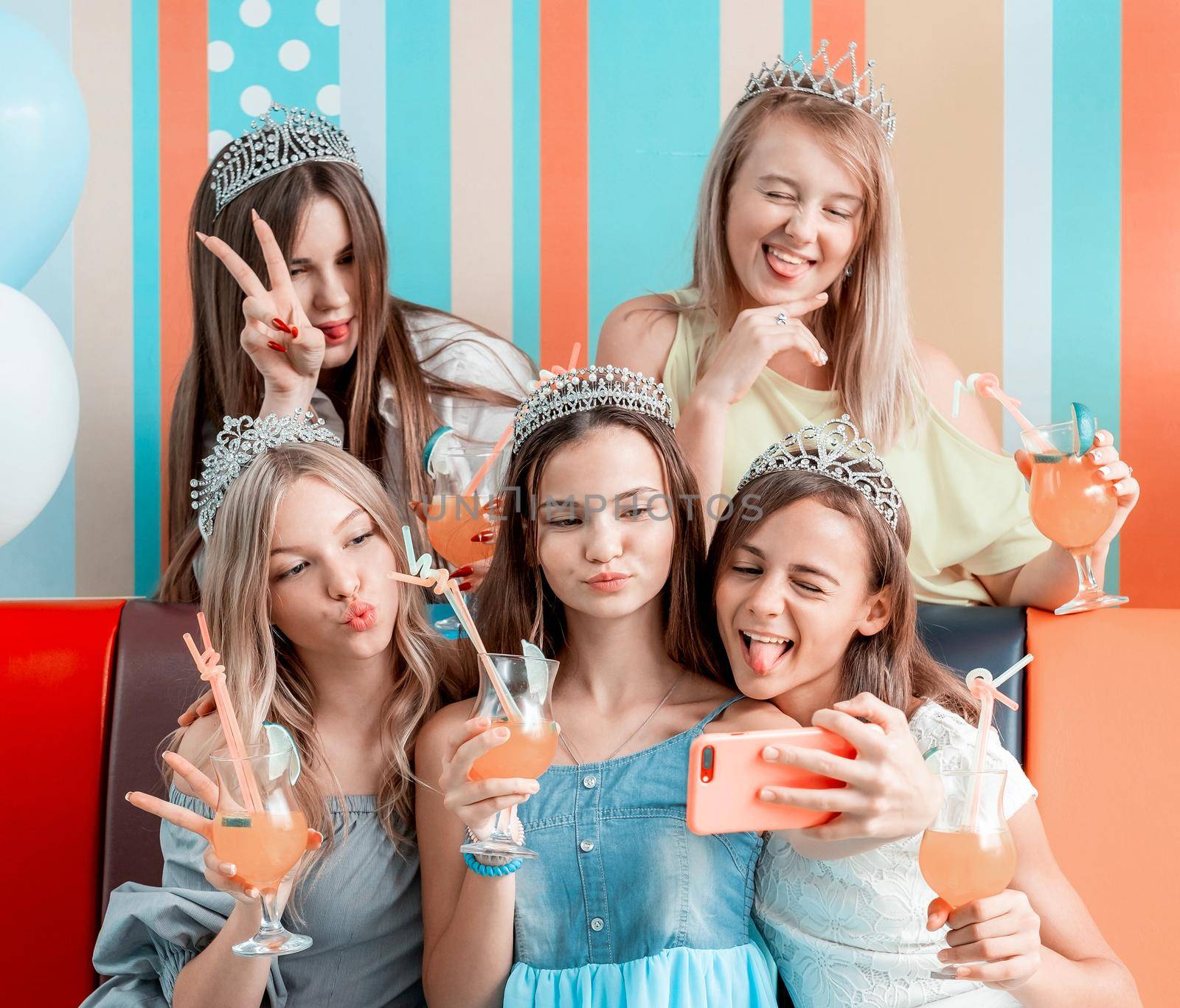 Funny girls taking selfie at birthday celebration