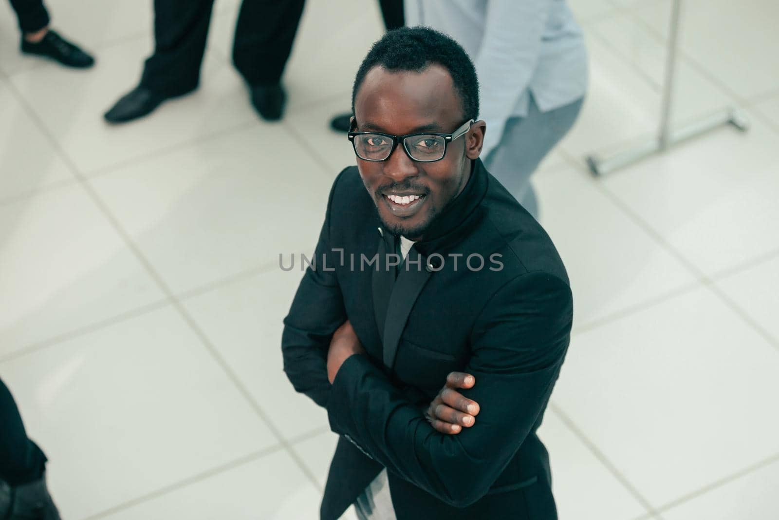 top view. smiling young businessman looking at the camera