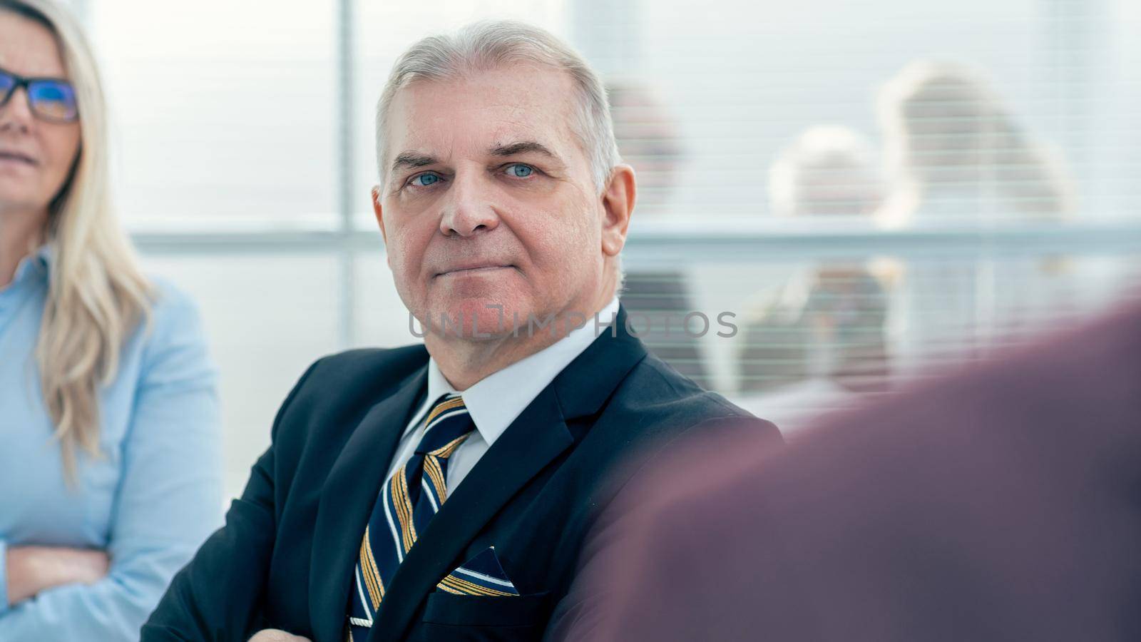 close up. thoughtful serious employees standing in the office. business people