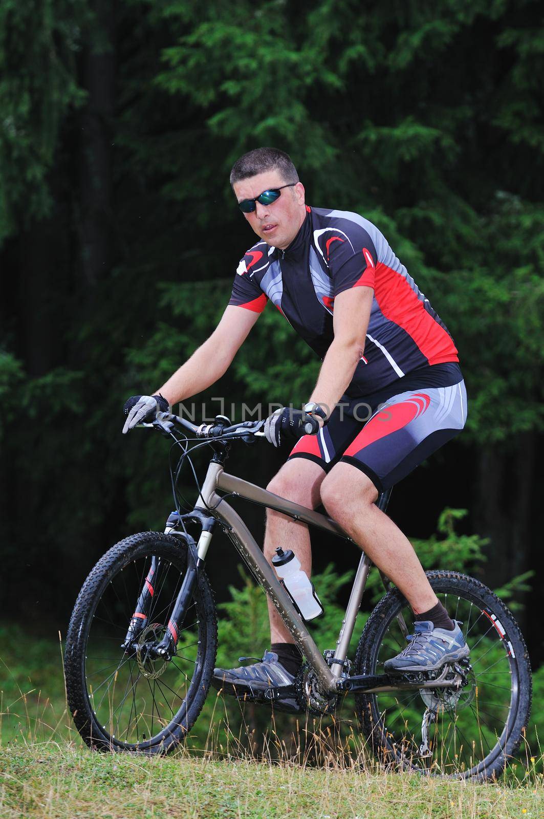healthy lifestyle and fitness concept with mount bike man outdoor