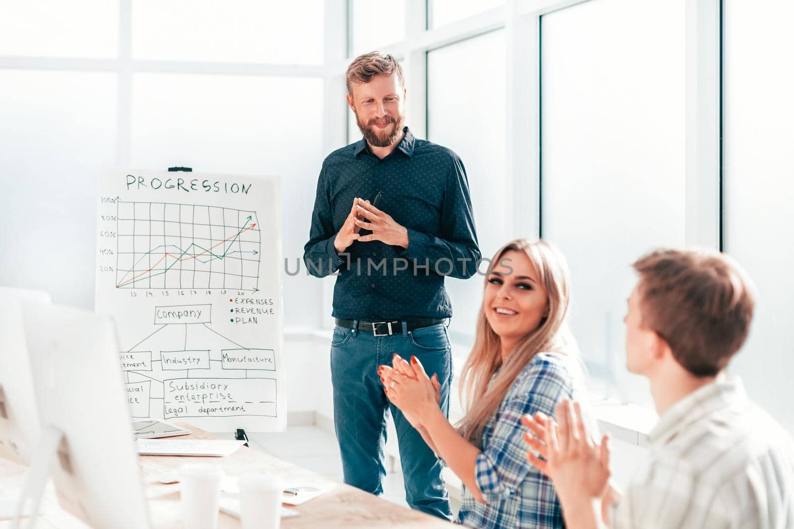 employees applaud the speaker at the business presentation . photo with copy space