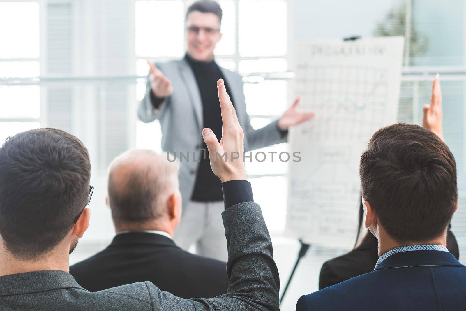 speaker asks questions during the business seminar. business and education