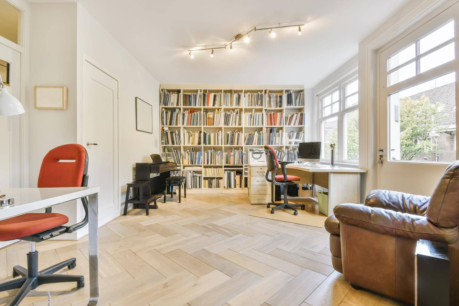 Large cozy living room with a large wall-to-wall library