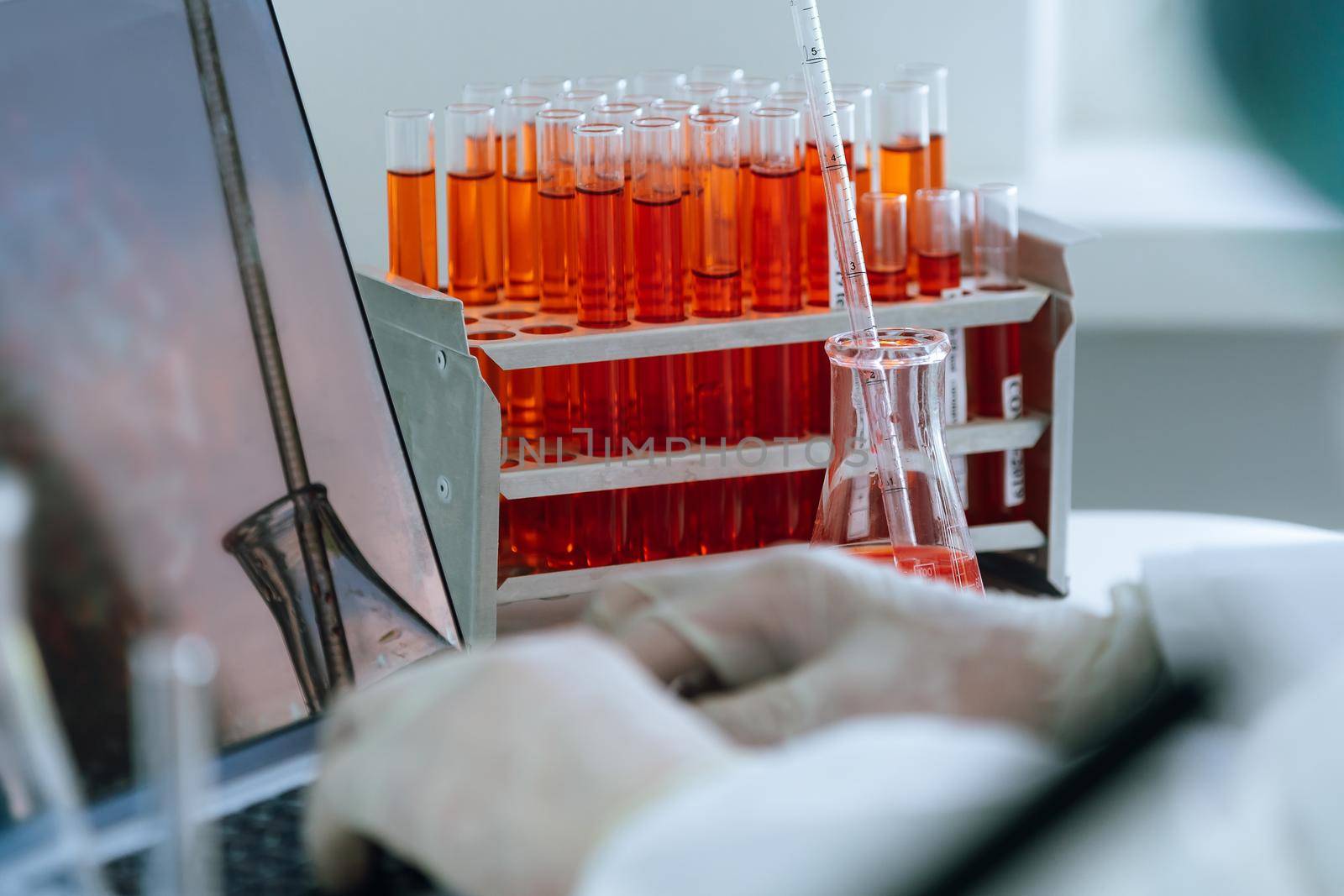 close up. scientist works on a laptop in a modern laboratory. science and health.