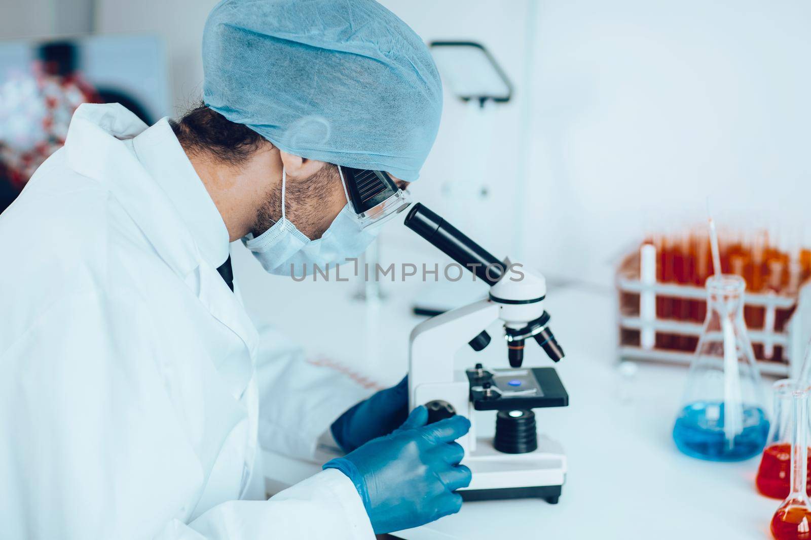 close up. talented scientist sitting at a table in the laboratory.