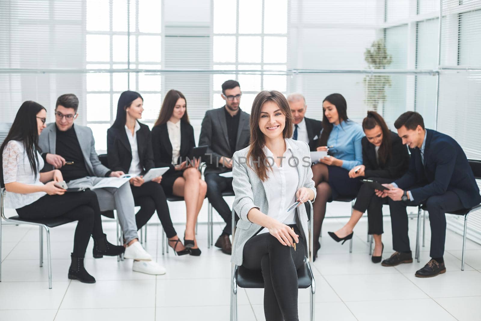 successful businesswoman and a group of leading experts in the conference room. photo with copy-space