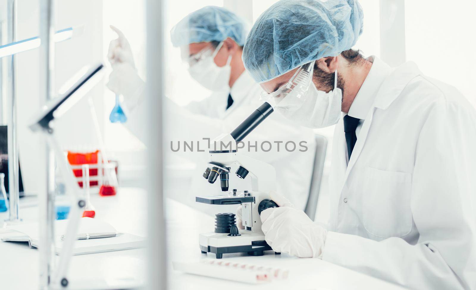 close up. scientist using a microscope in the laboratory . photo with a copy-space.