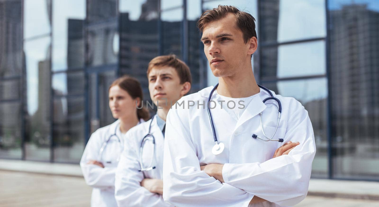 close up. team of doctors standing on a city street. photo with a copy-space.