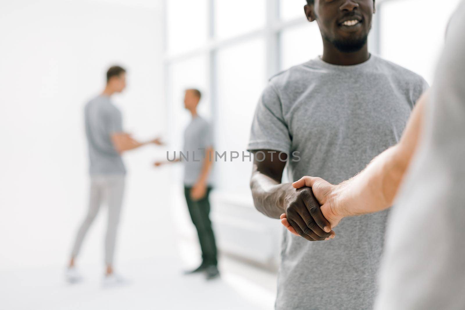close up. friendly handshake of young people. photo with copy space