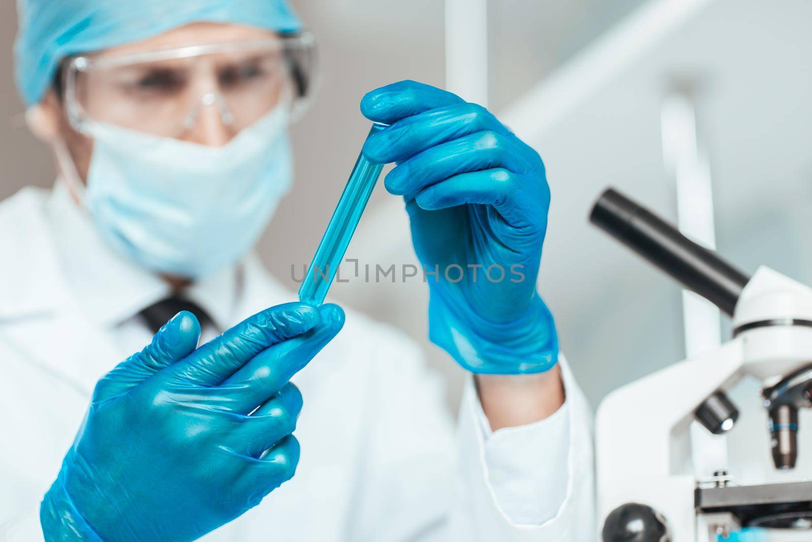 close up. sample of the vaccine in the hands of the researcher .