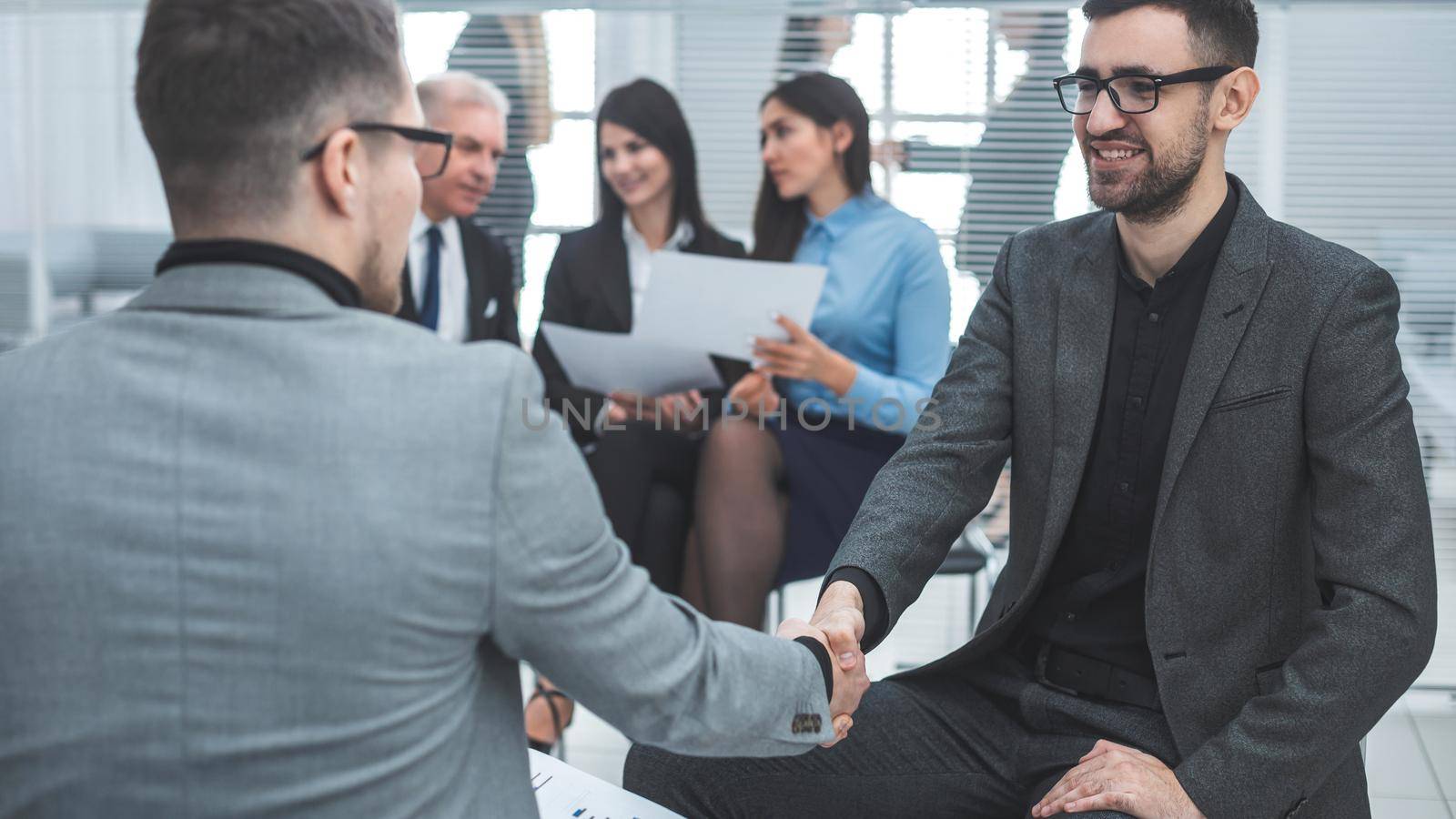 close up. business people shaking hands in agreement. success concept