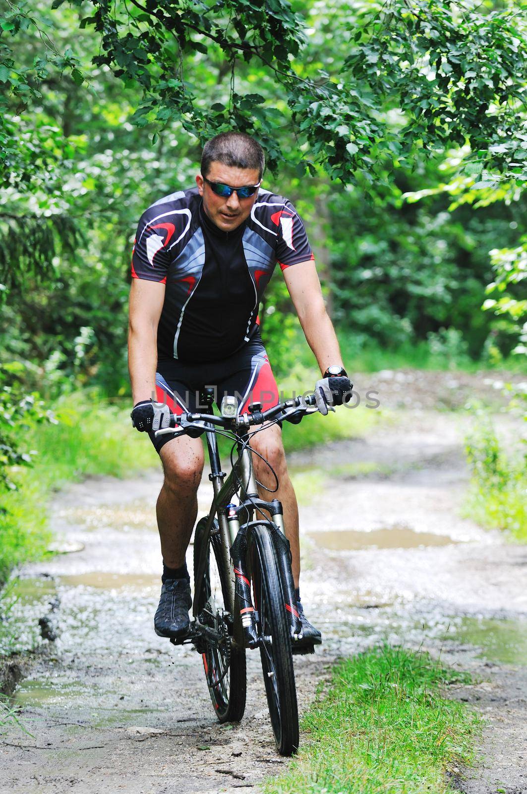 healthy lifestyle and fitness concept with mount bike man who ride bike  outdoor