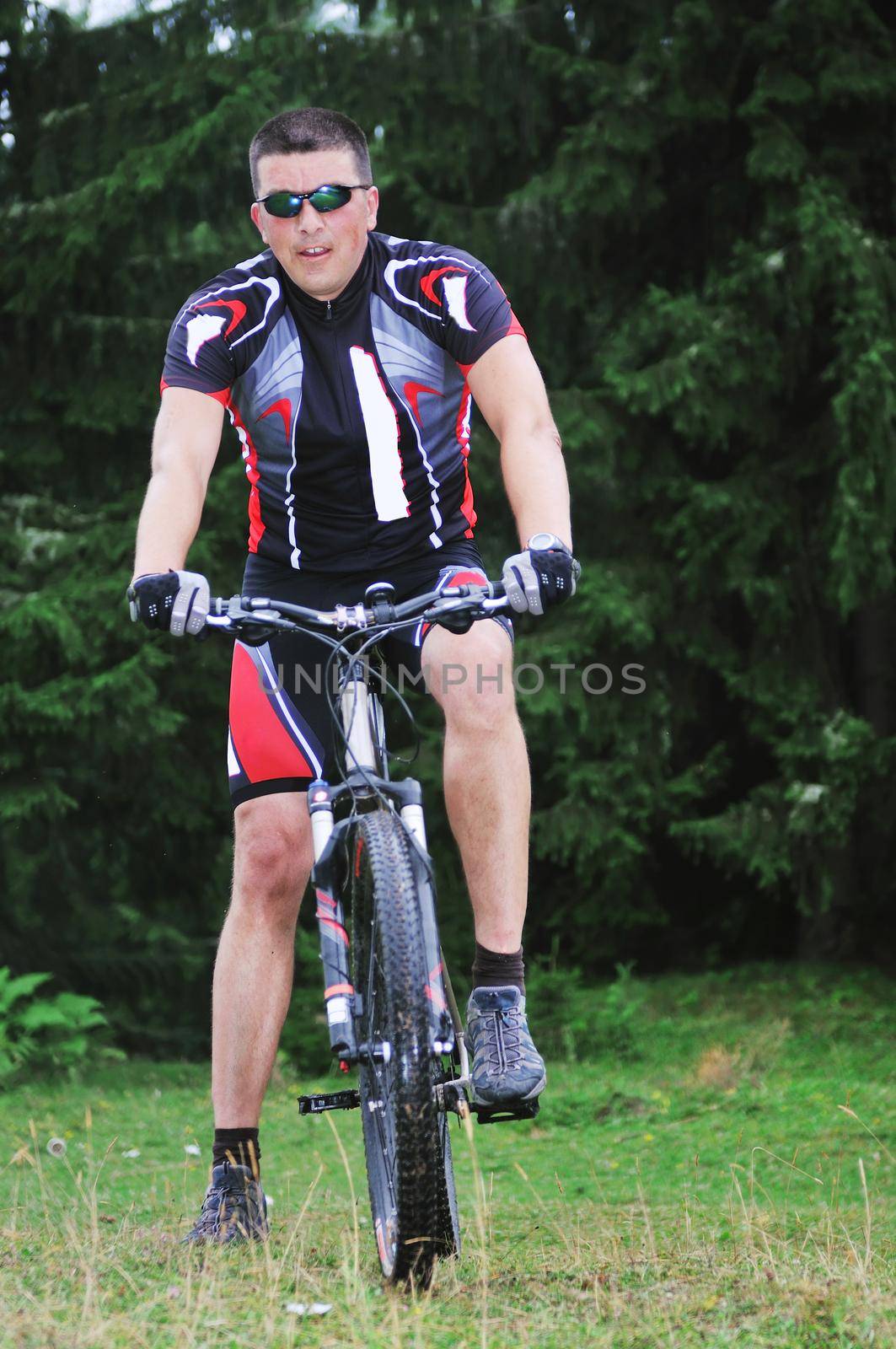 healthy lifestyle and fitness concept with mount bike man who ride bike  outdoor