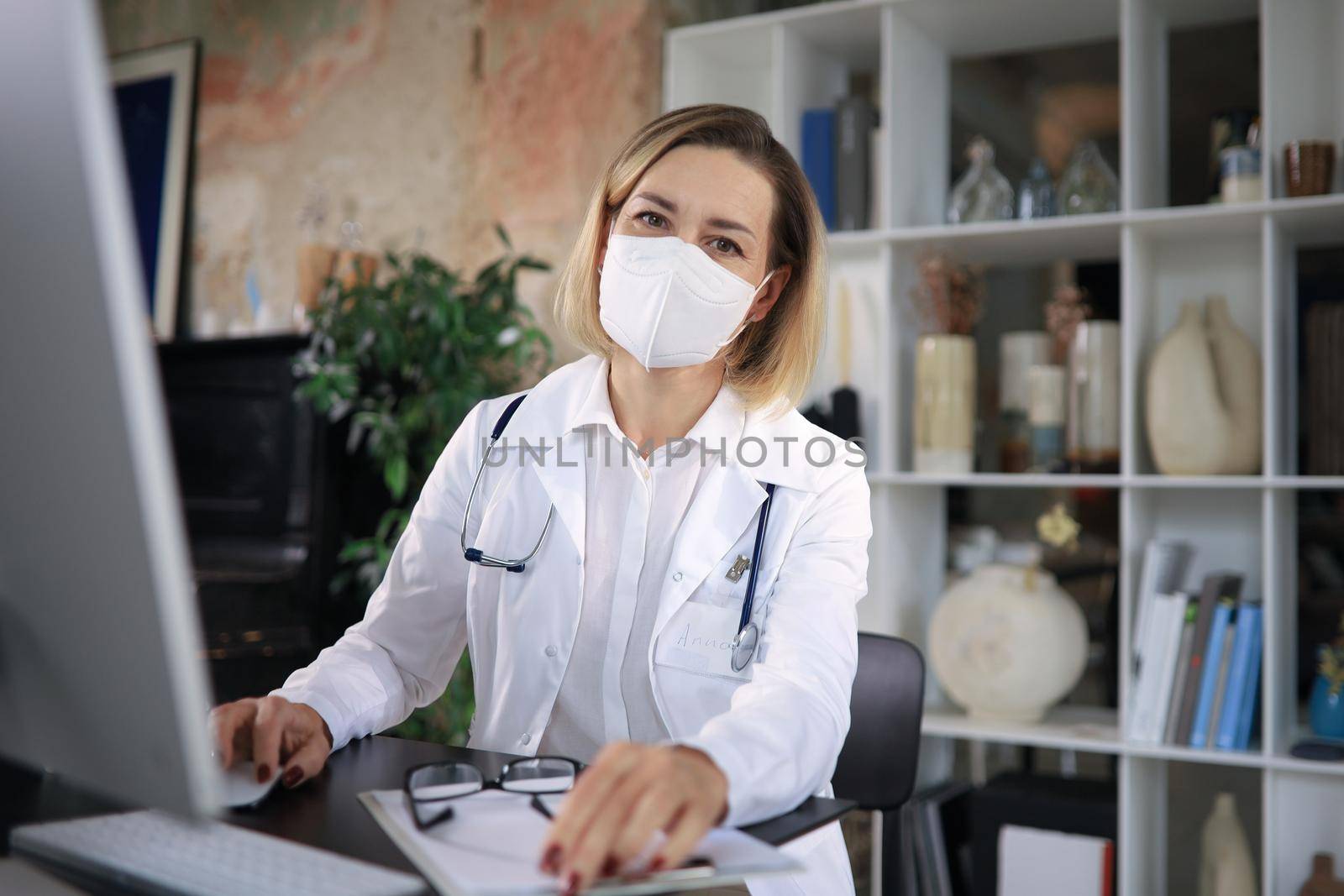 Middle aged female doctor therapist on consultation