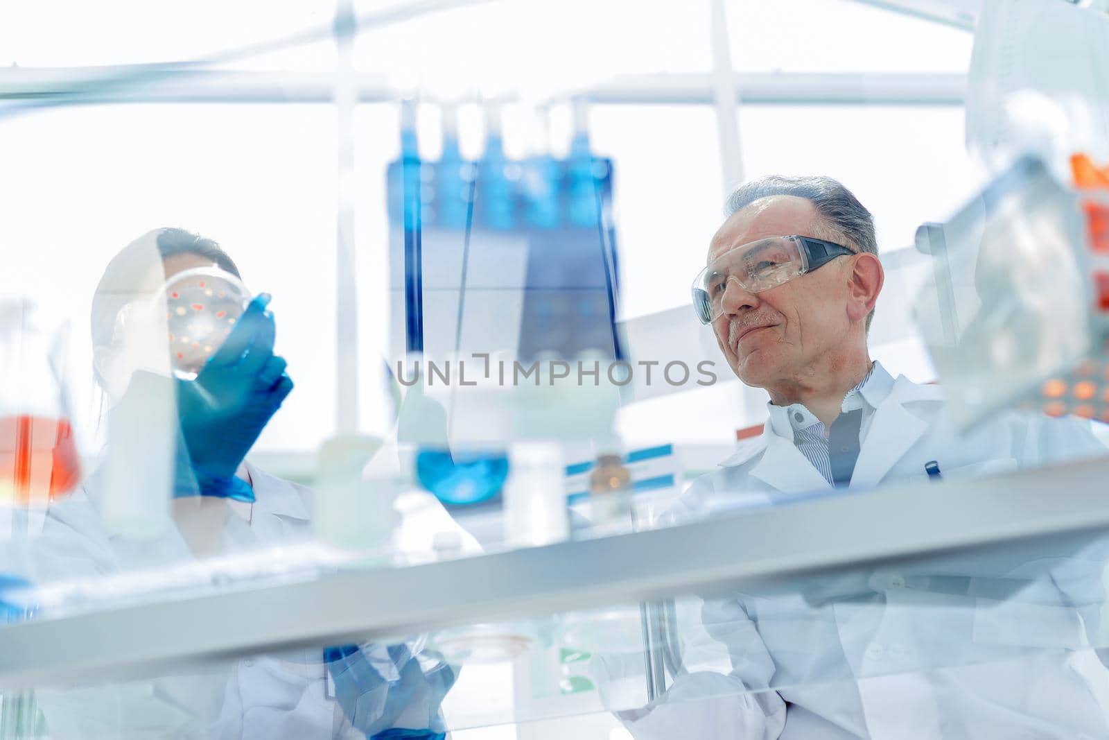 close up. employees of a scientific laboratory testing a new vaccine . photo with a copy-space.
