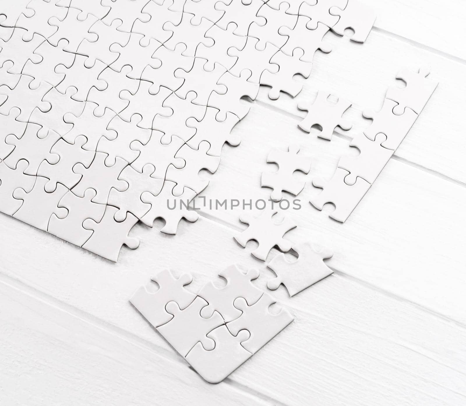 Matching pieces of empty puzzle on white background