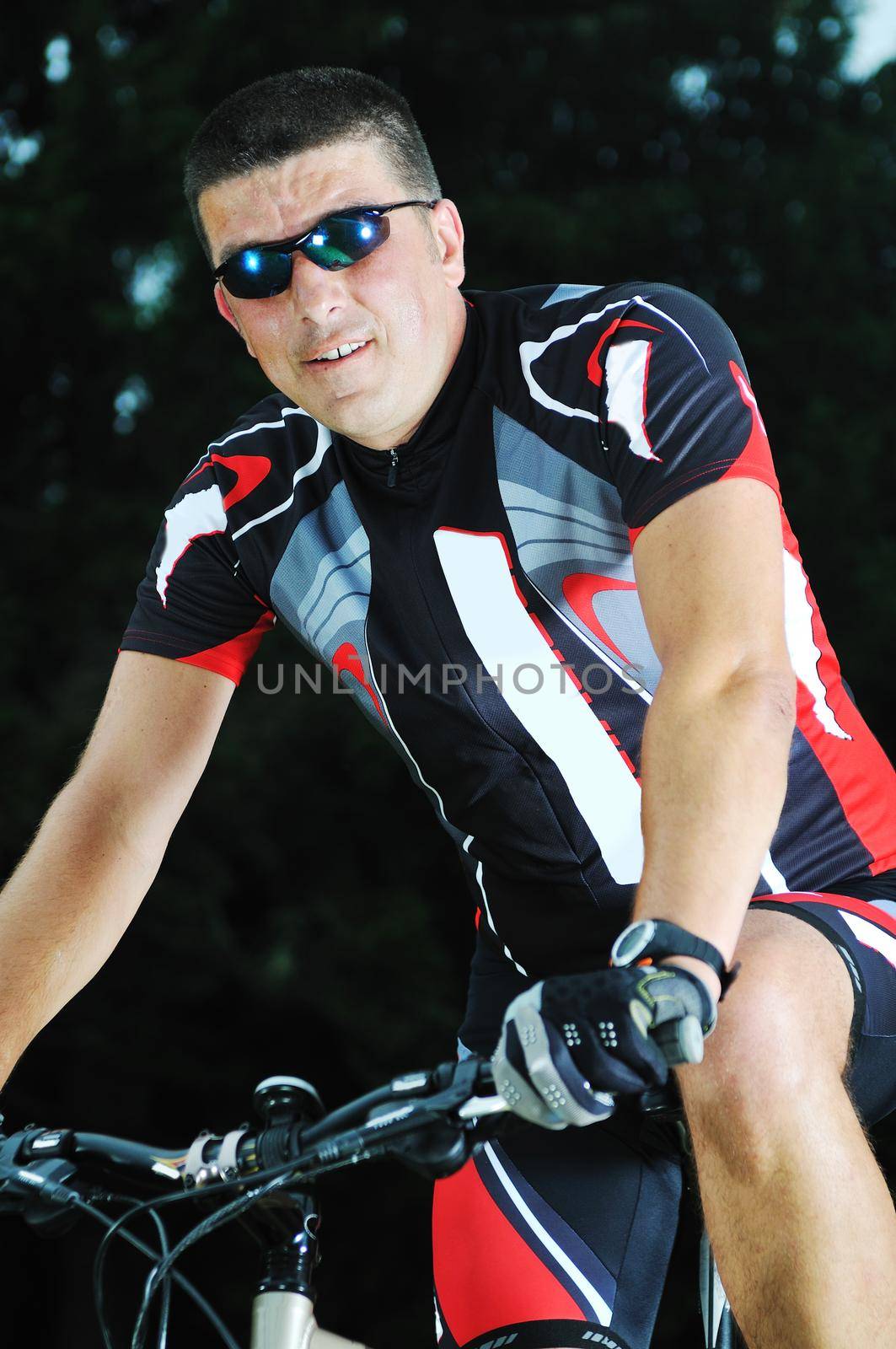 healthy lifestyle and fitness concept with mount bike man who ride bike  outdoor