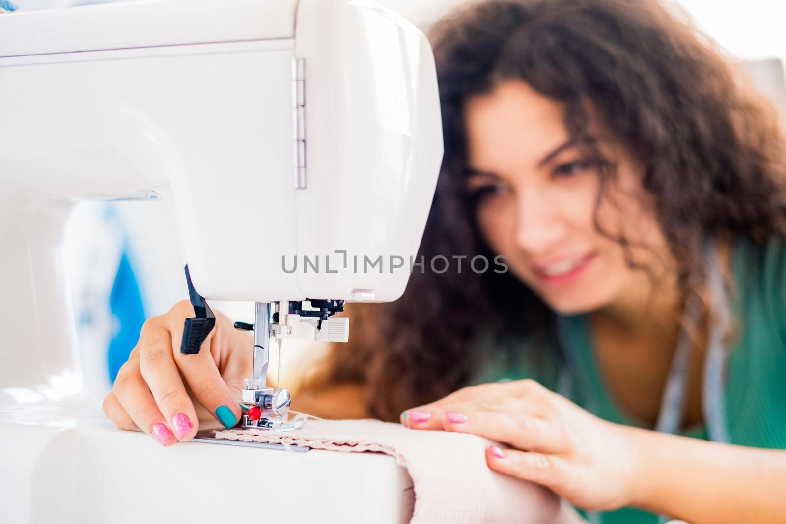 Close up view of sewing female hands