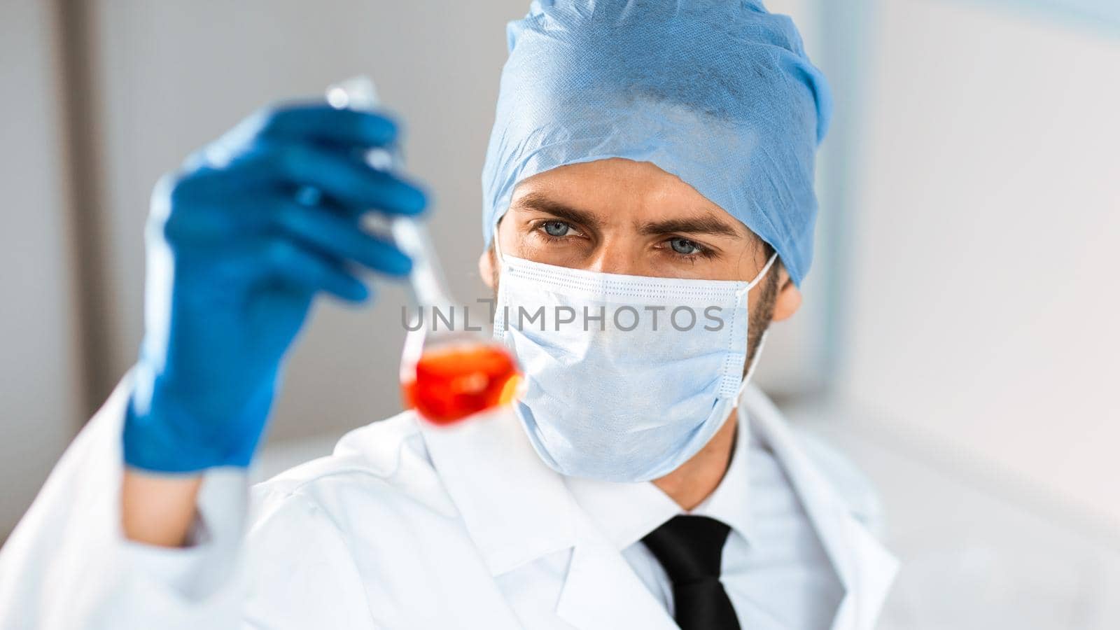 close up. medical flask in the hands of a laboratory assistant. science and health.