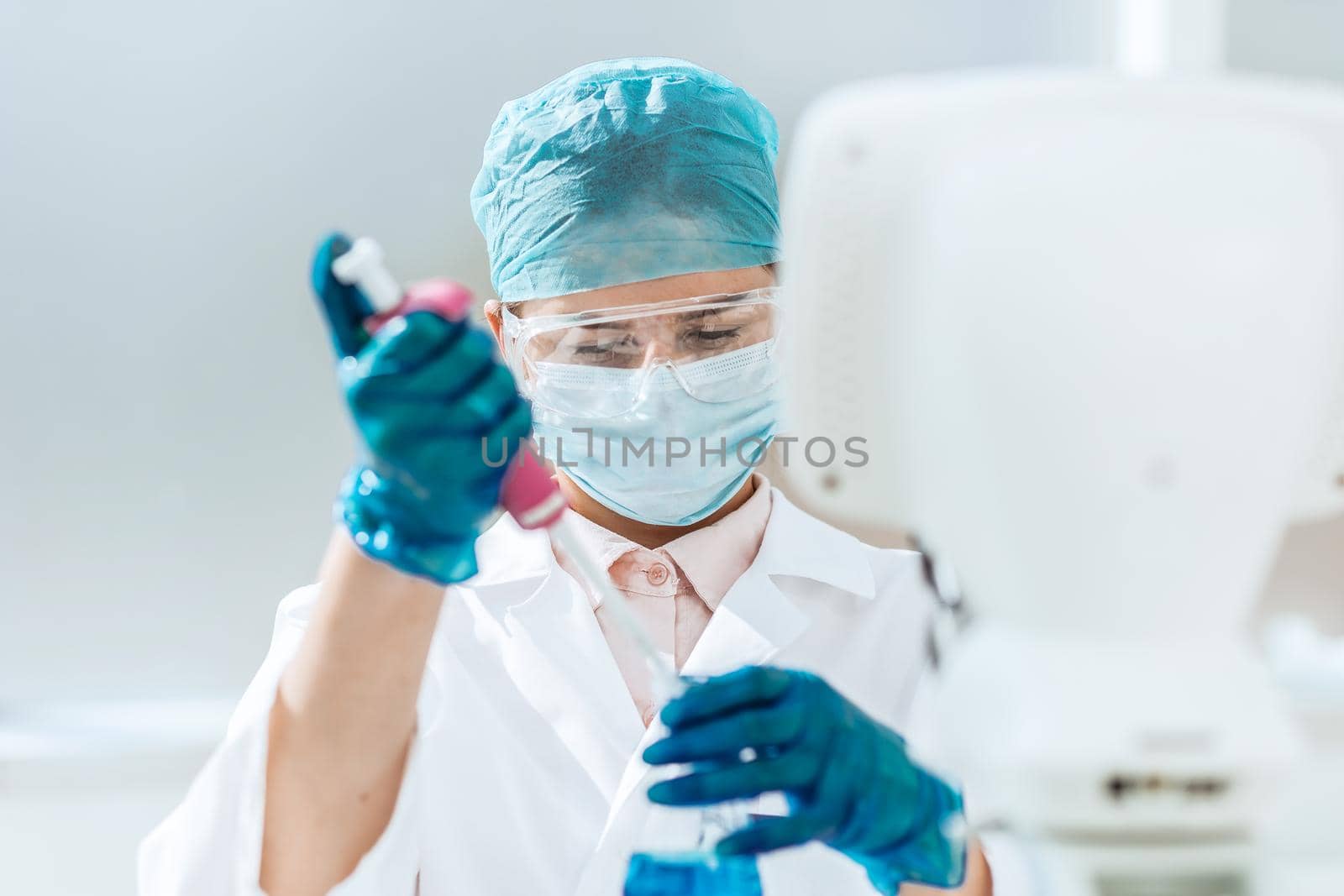 close up. female scientist examining a liquid in a laboratory flask . science and health.