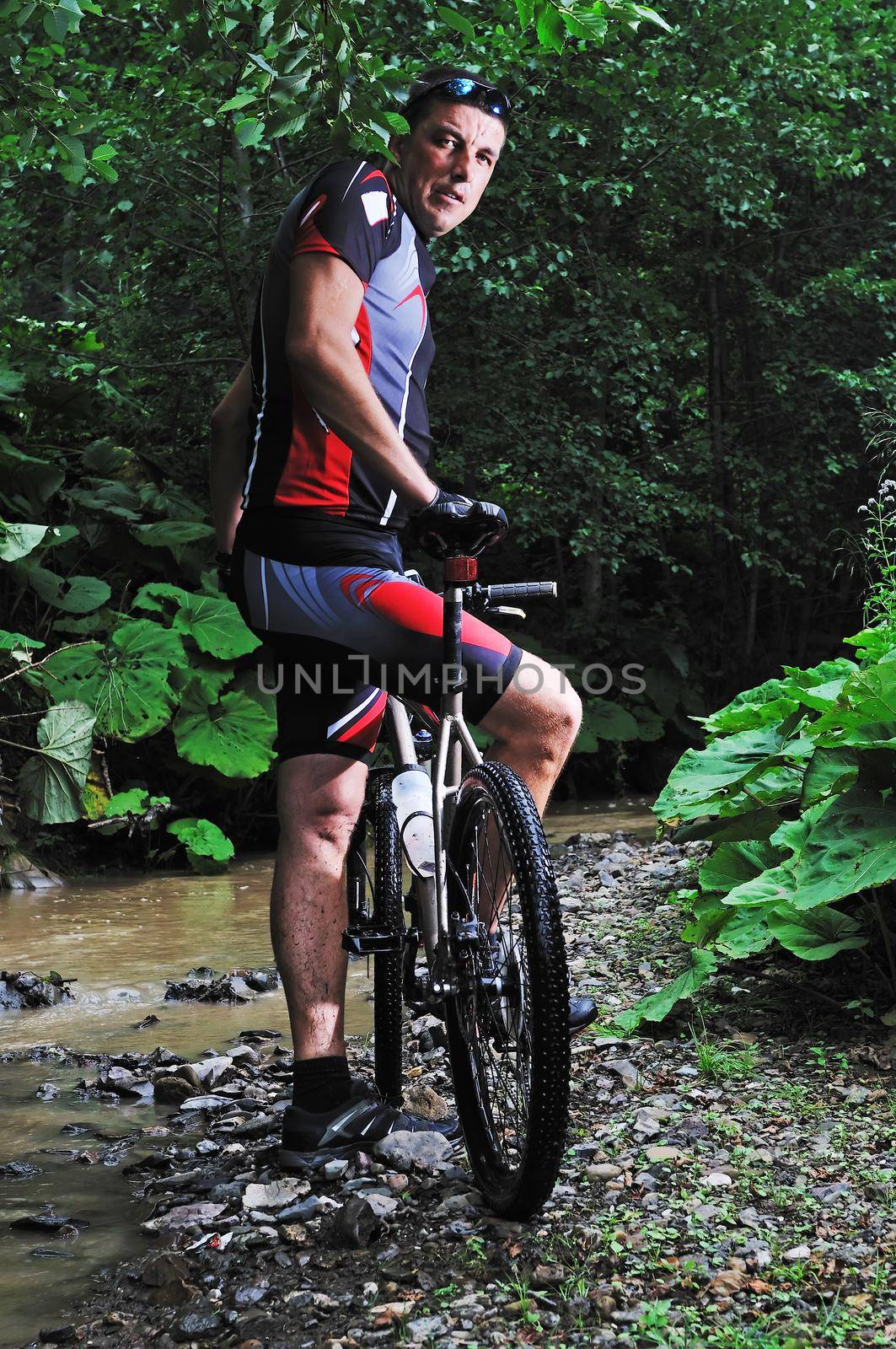 healthy lifestyle and fitness concept with mount bike man outdoor