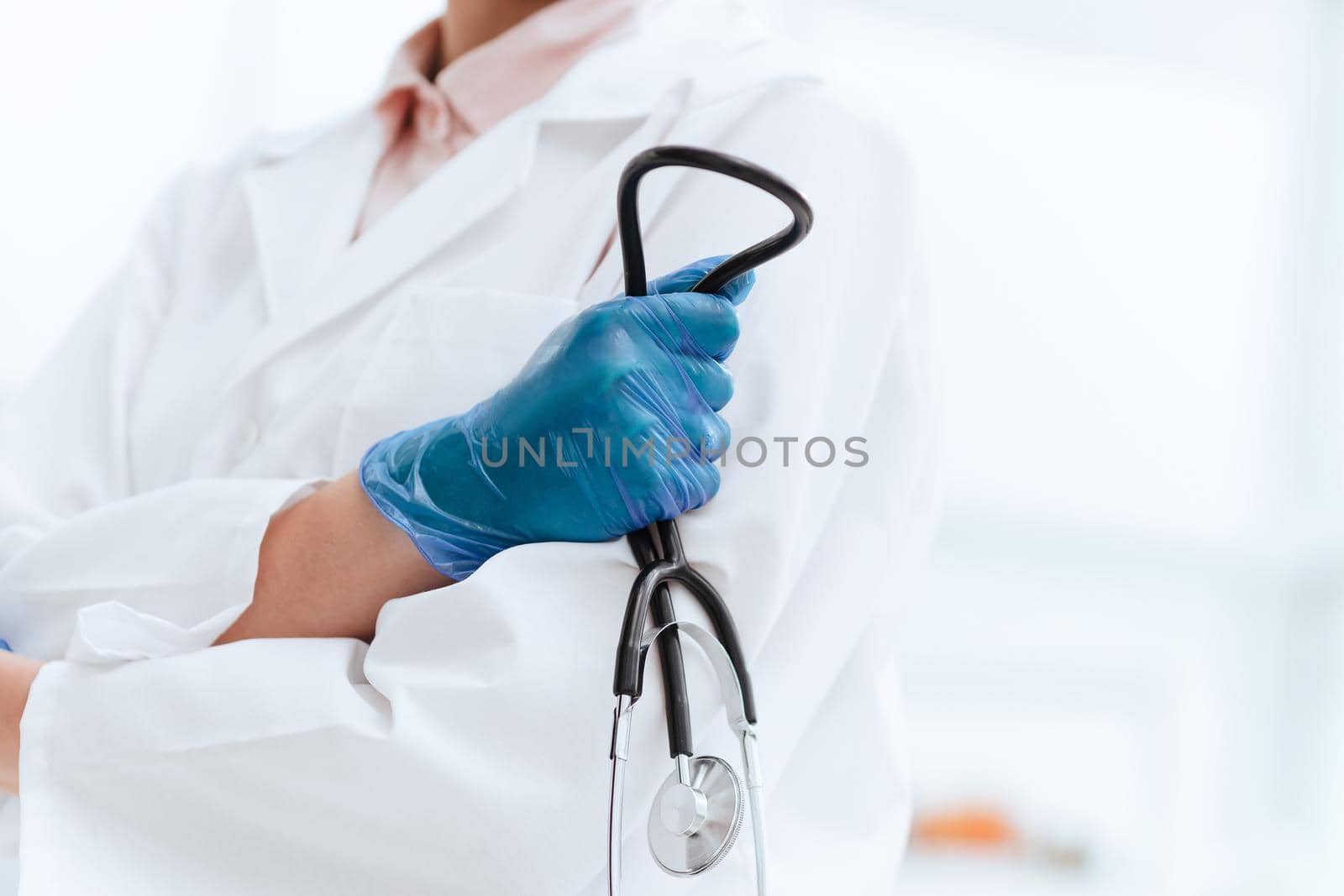 close up. stethoscope in the hand of a woman doctor . the concept of health care.
