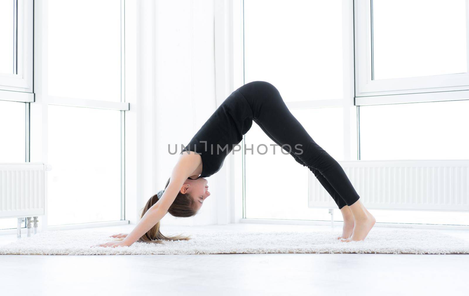 Beautiful girl doing yoga asana by GekaSkr