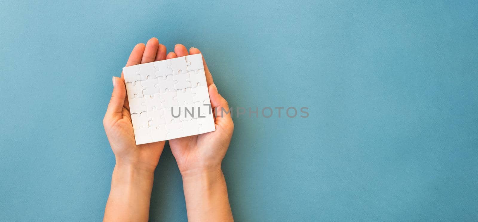 Small white square puzzle on a blue background