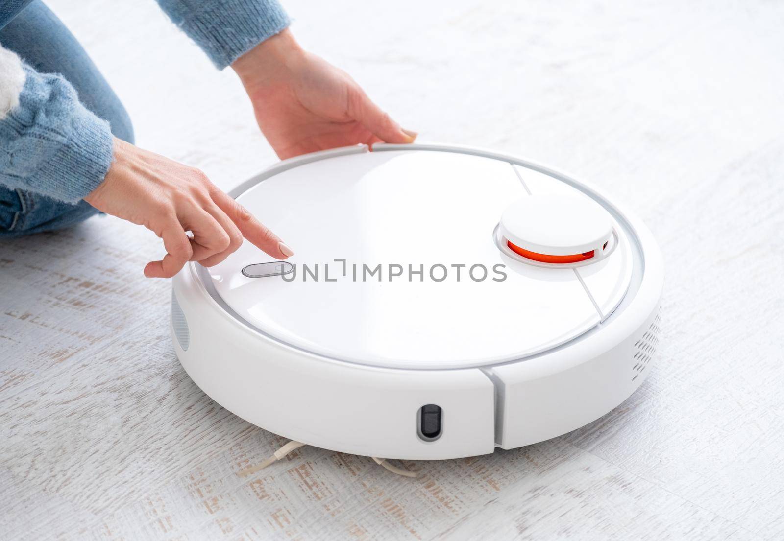 Switching on robotic vacuum cleaner in light room