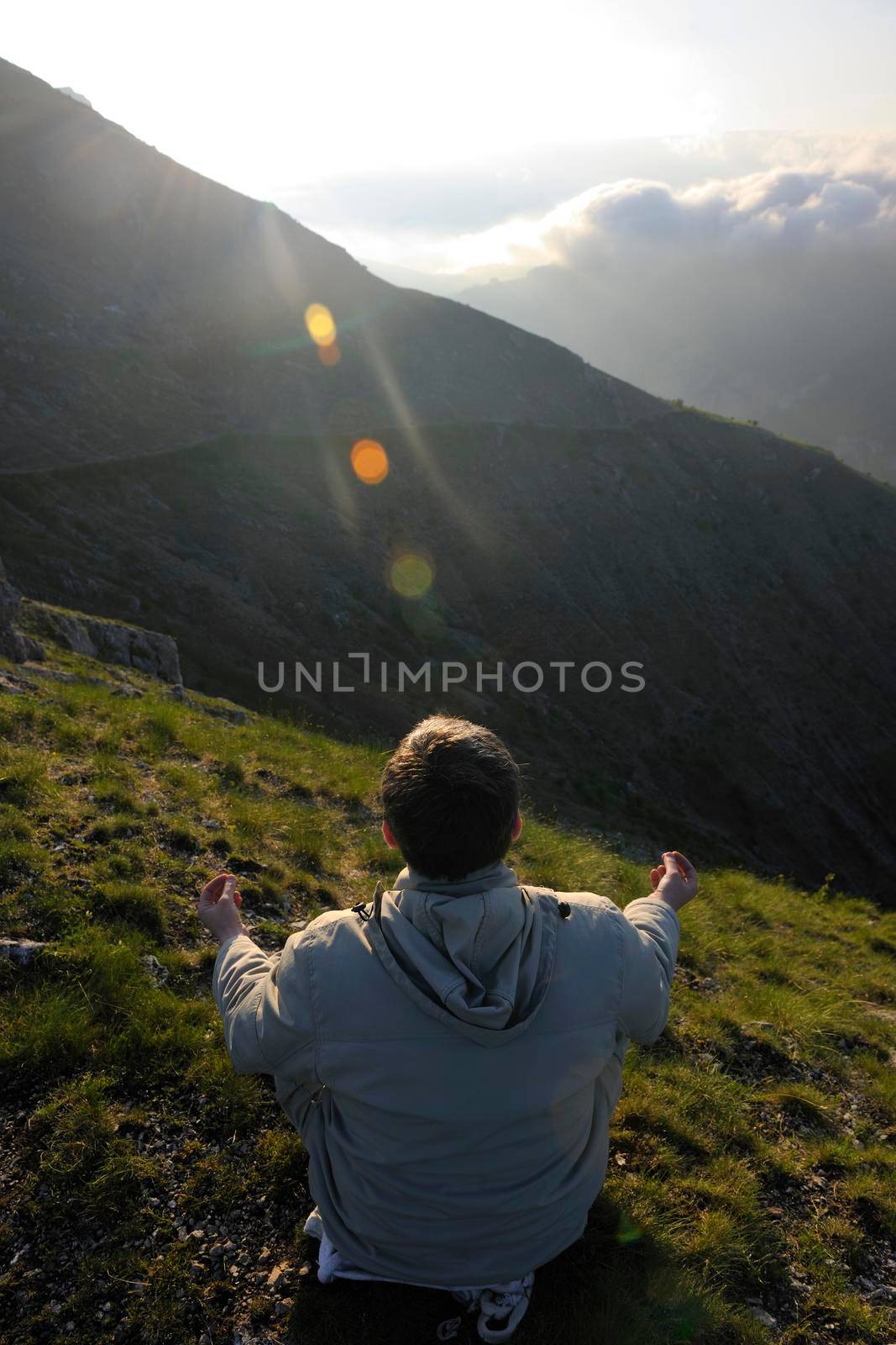 healthy young man practice youga in height mountain at early morning and sunrise