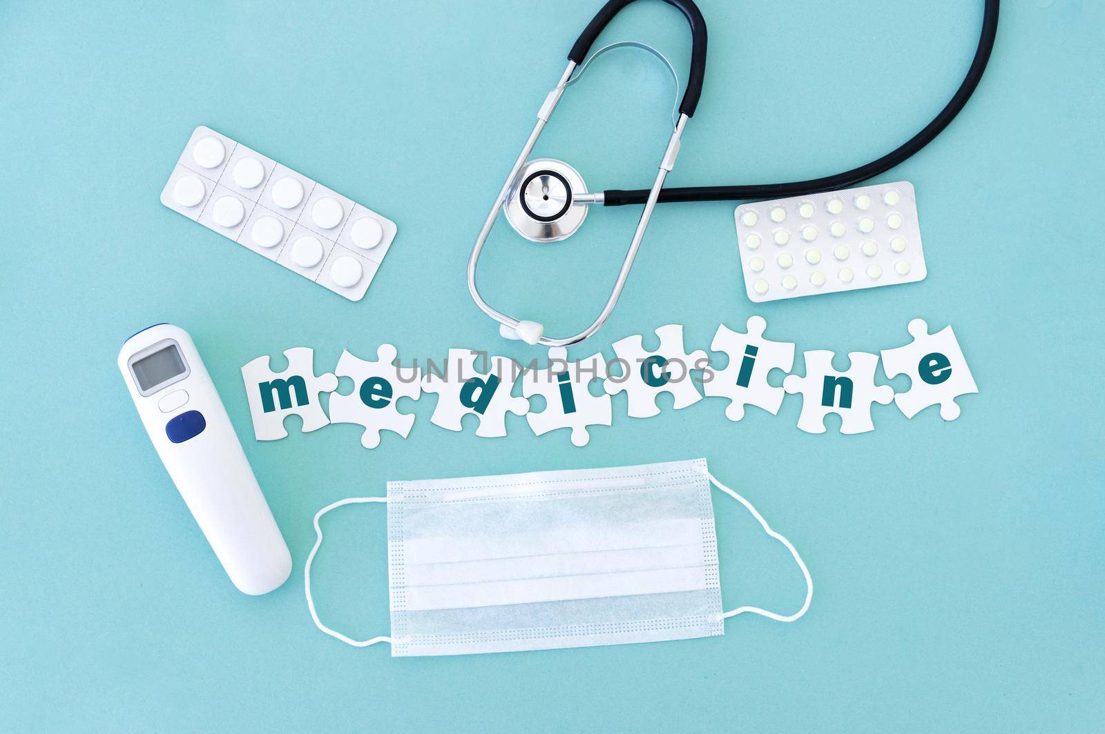 Top view of medical equipment and blank puzzle pieces