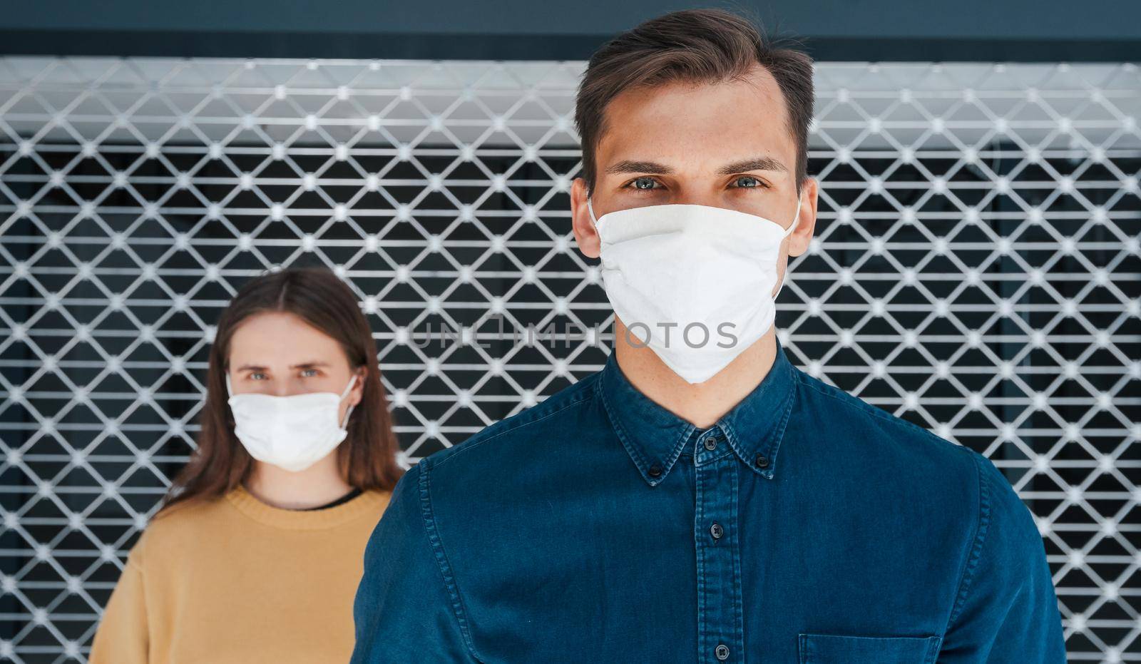 close up. a man and a woman in protective masks standing next to each other . the concept of health