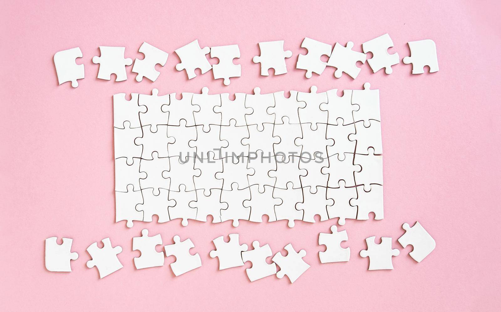 White jigsaw puzzle with unconnected pieces