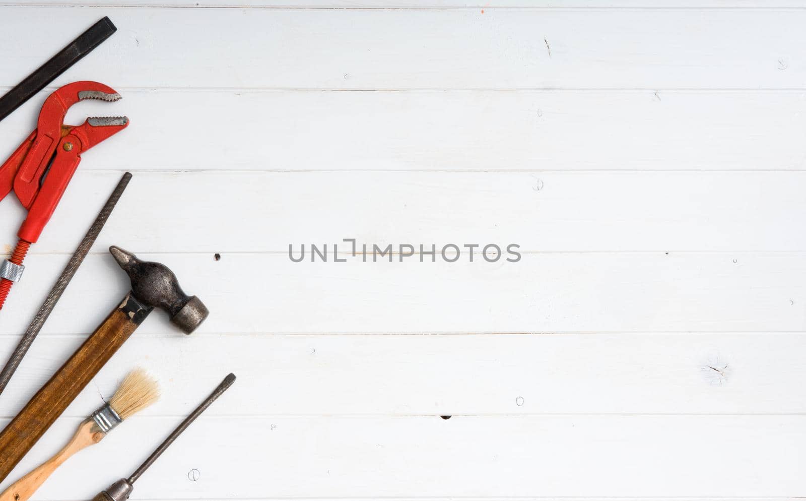 set of instruments with text space on white wooden background with copyspace